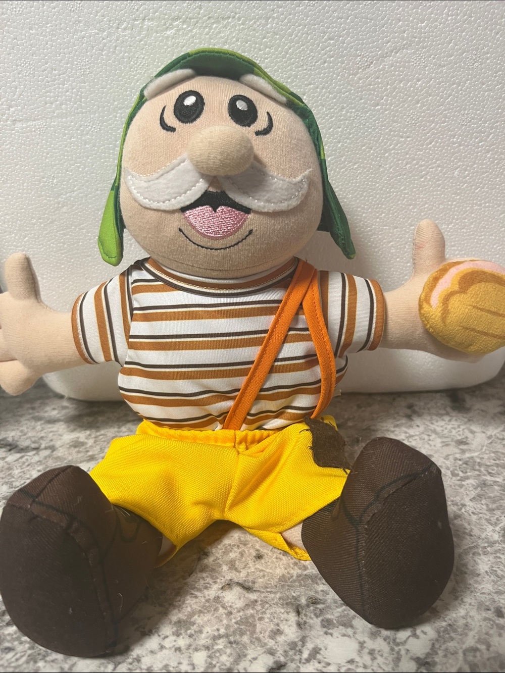 Plush Striped Doll with Yellow Outfit and Green Cap